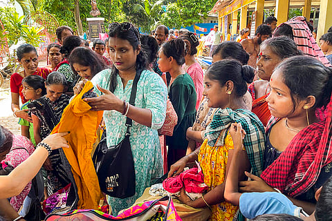 Tripura Floods: Volunteers distribute clothes among flood-affected people